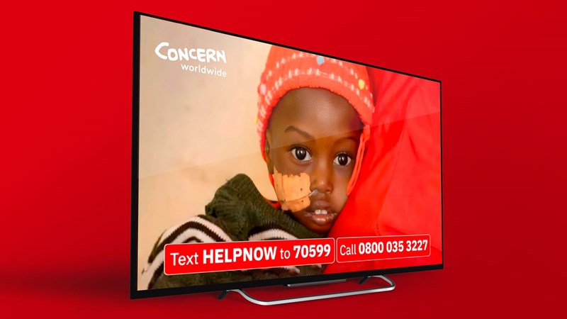 the ad on a tv screen with sick child looking at ahead